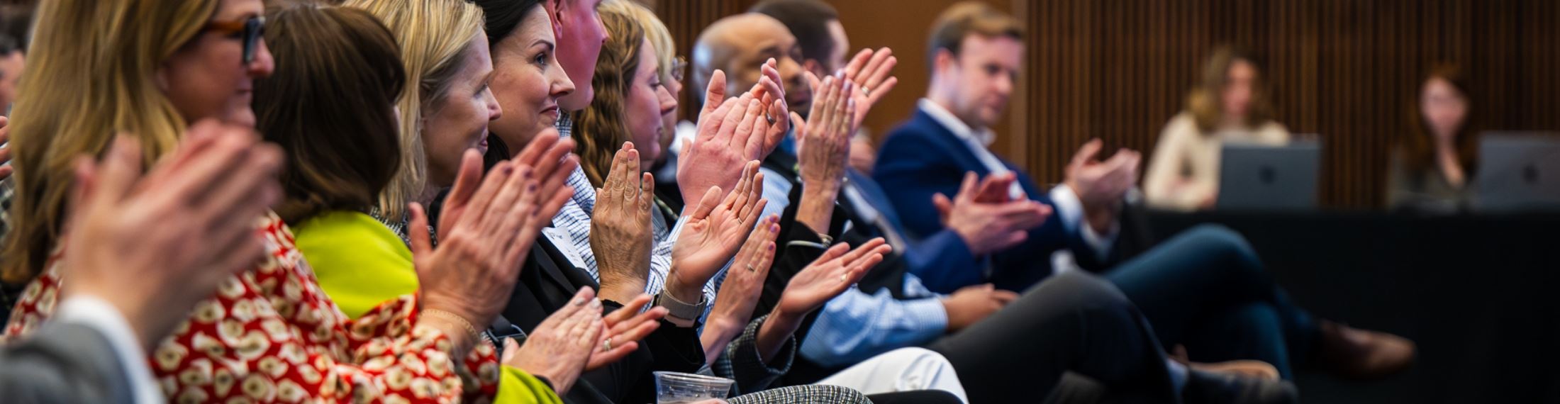 Row of people clapping